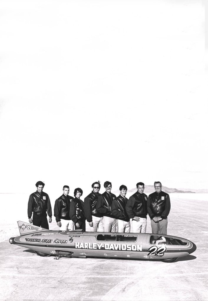 Cal Rayborn standing next to the Harley-Davidson streamliner.