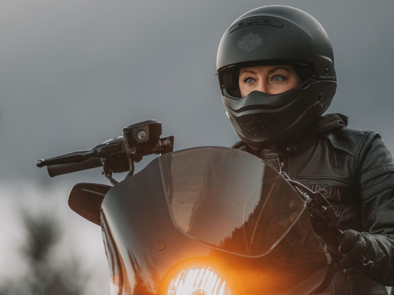 A close-up of ANDRA NEDELCU on her motorcycle.