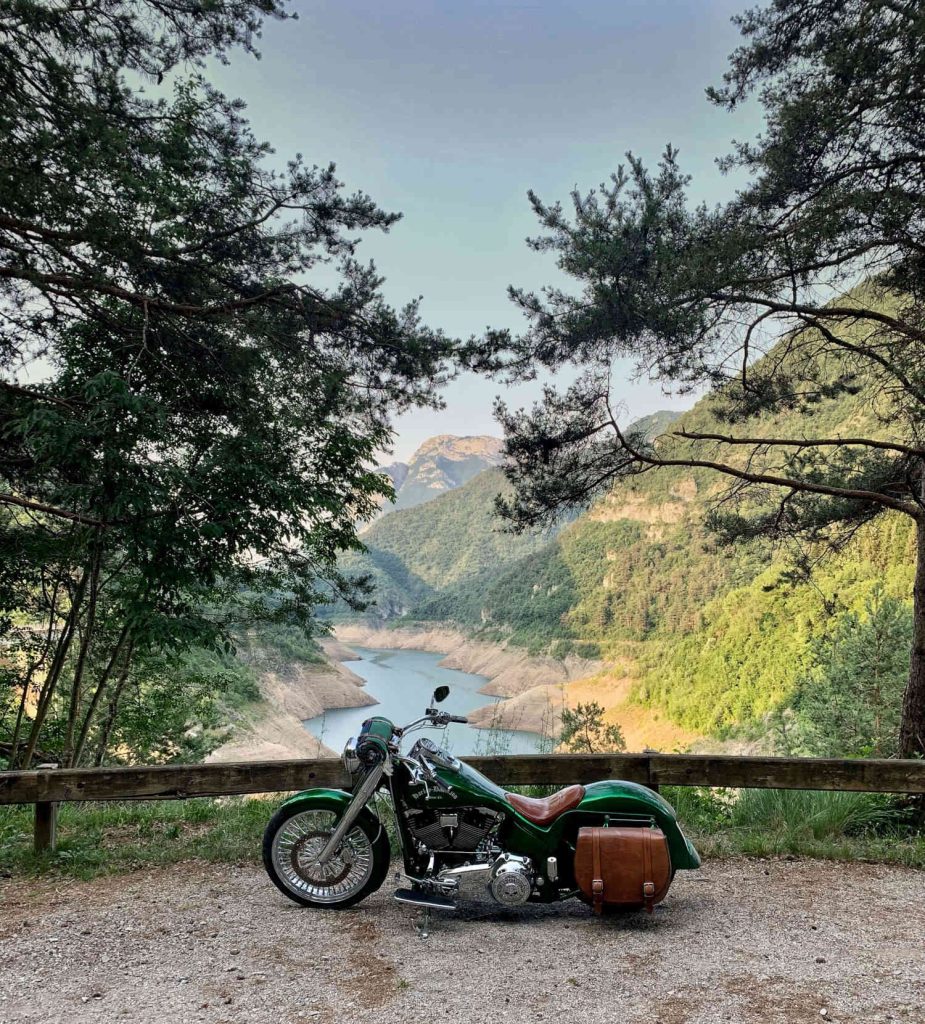 A picture of a motorcycle with a river in the background.