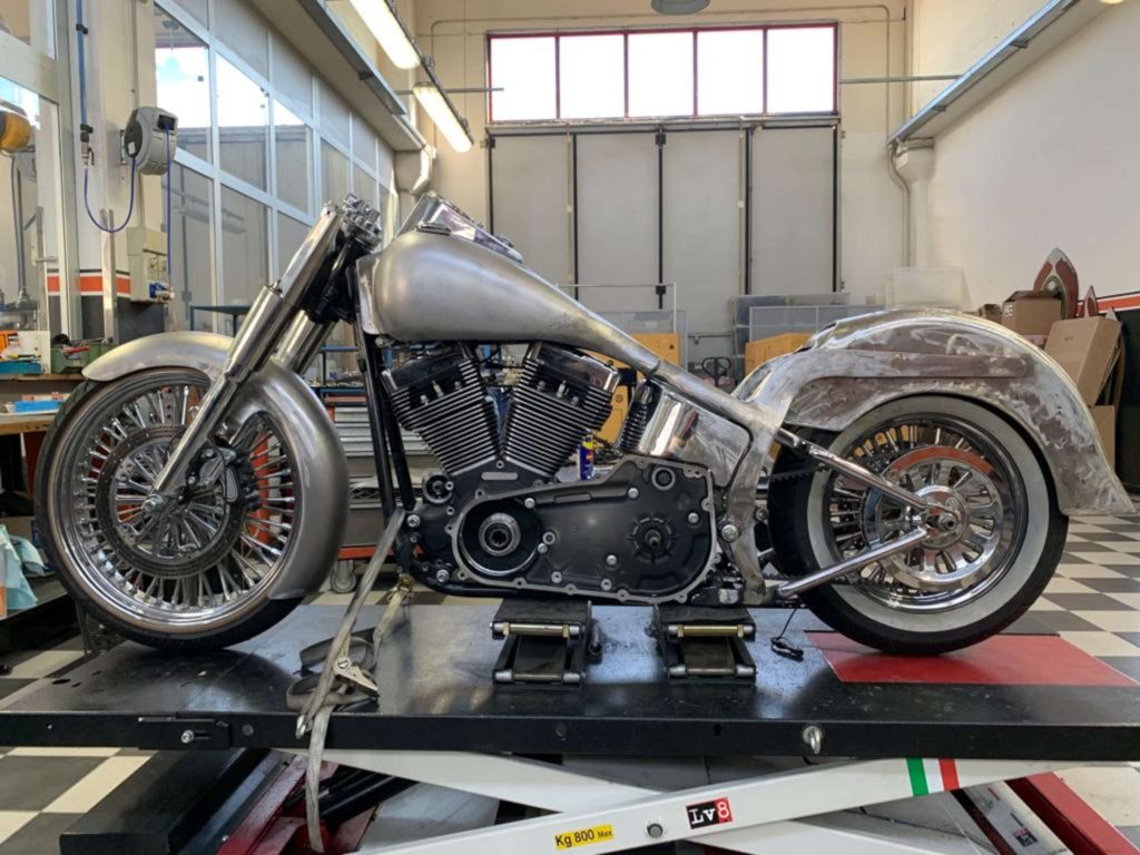 A picture of a half-painted motorcycle.