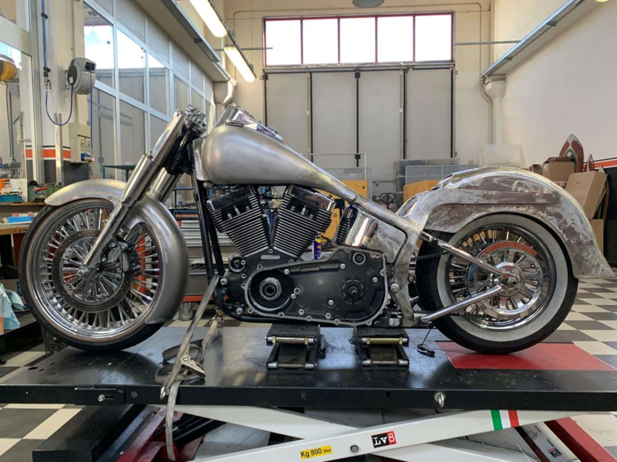 A picture of a half-painted motorcycle.