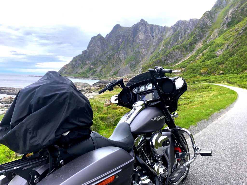 A motorcycle next to some mountains.