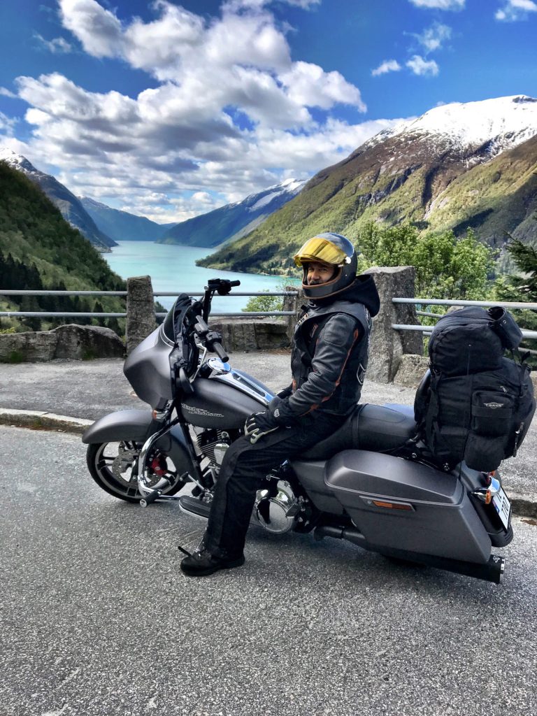 A man sitting on a motorcycle.