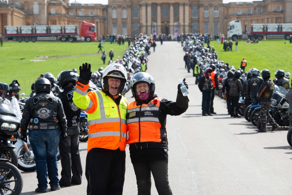 H.O.G. members gathered with their motorcycles.