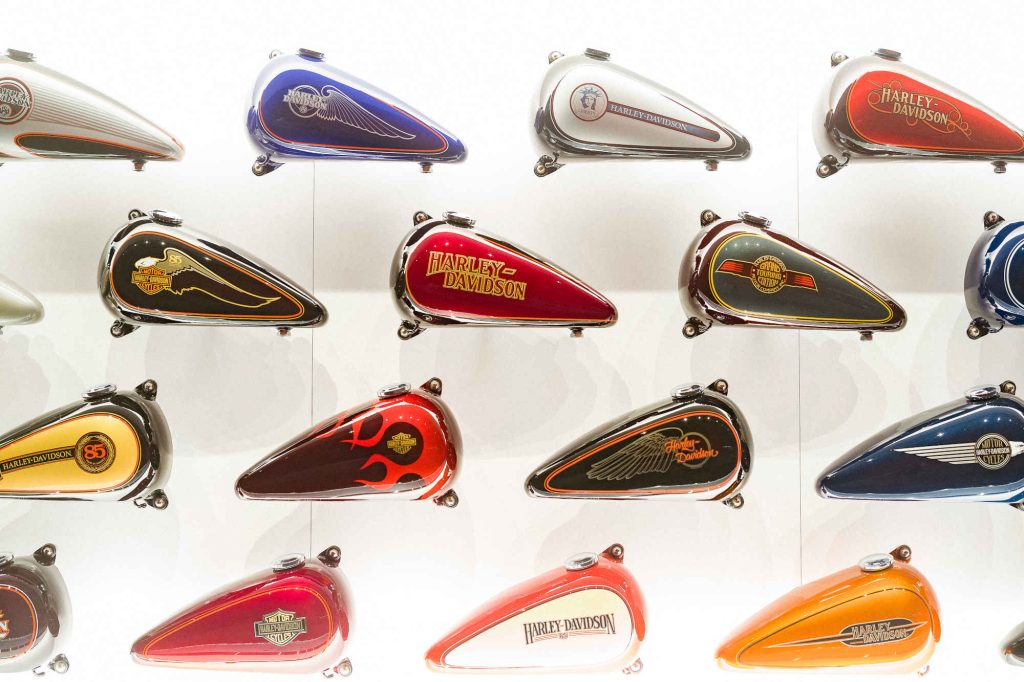 Shelf of multi-colour styles of gas tanks