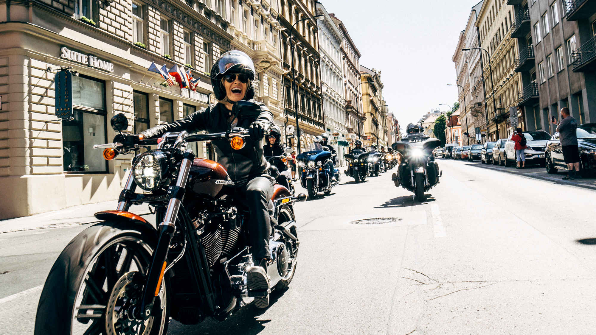 Karen Davidson riding a Harley in a parade