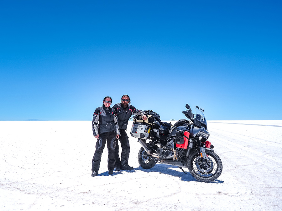 Ela and Greg on salt flats with motorcycle