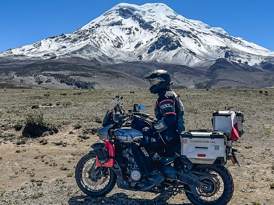 Biker on bike in front of mountain