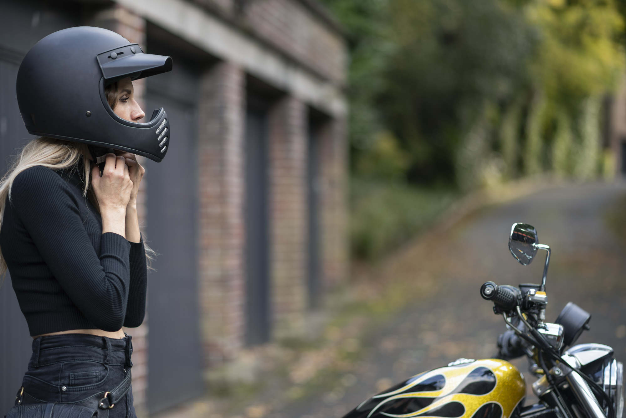 Laura tying up her helmet