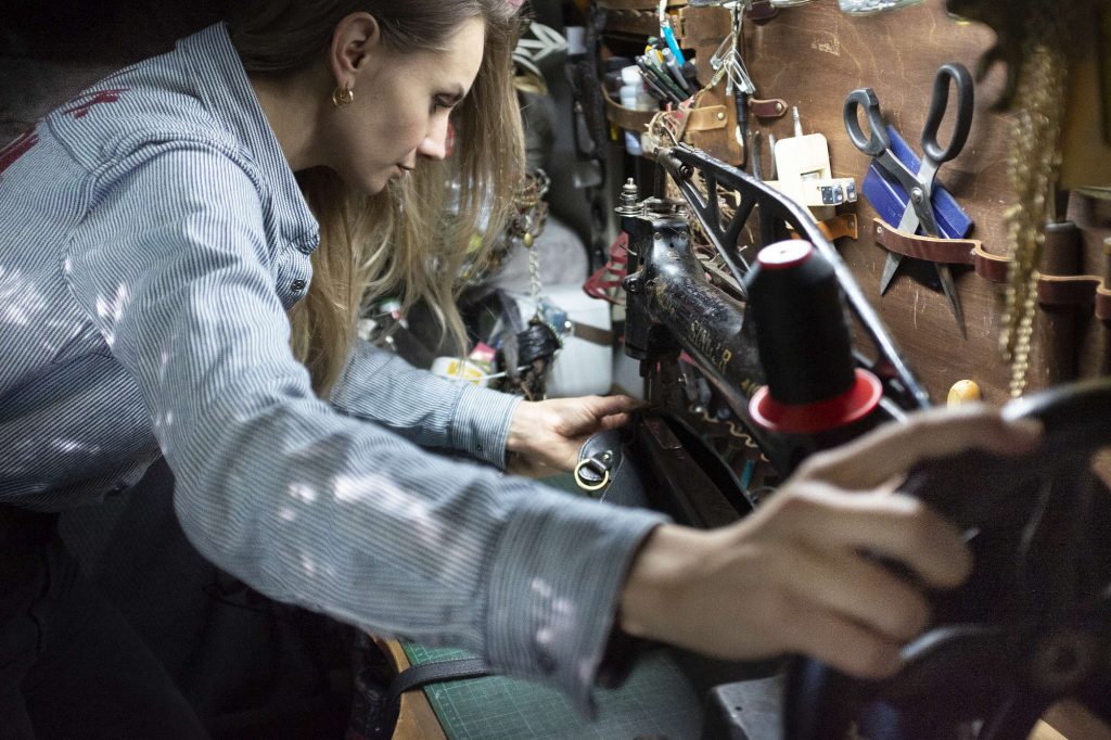 Laura working on her Harley-Davidson