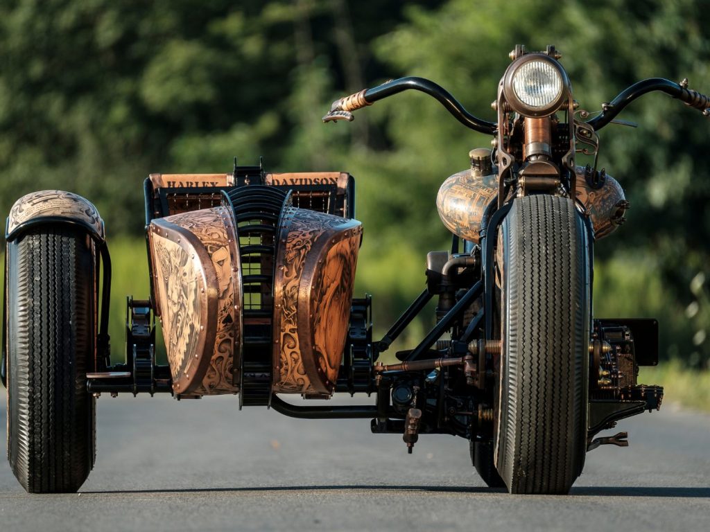 A Harley-Davidson and sidecar, complete with tattooed illustrations.
