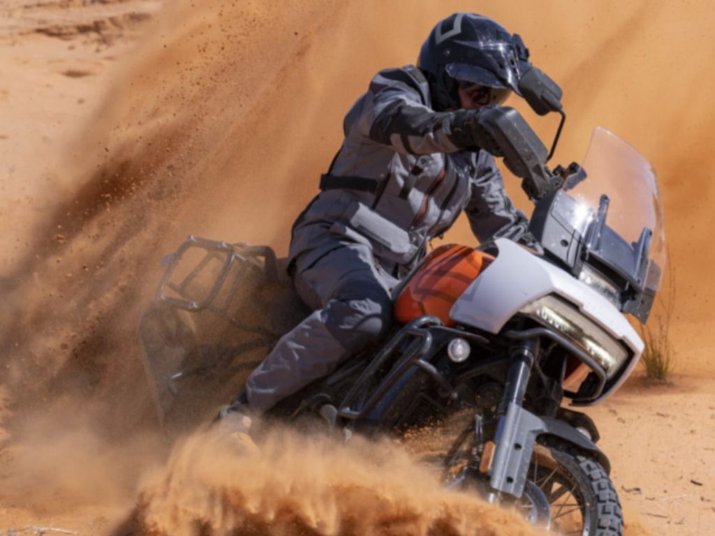 Ben Grabham rides his Revolution® Max in the red dust of the Australian desert