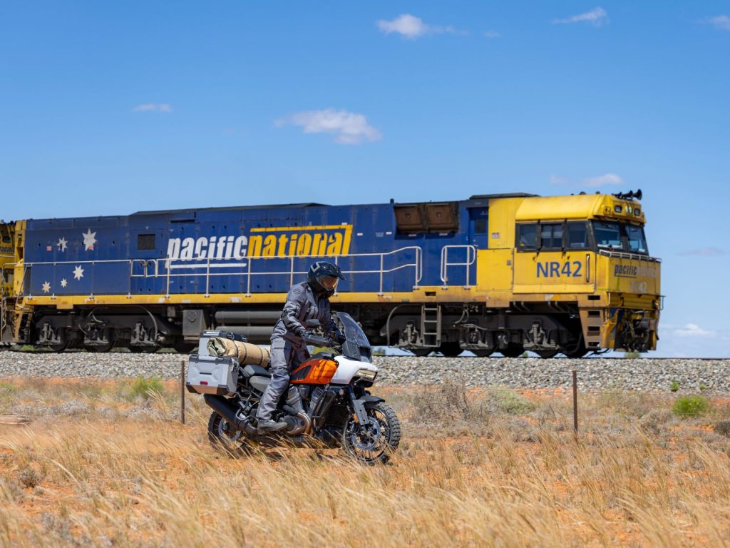 Ben Grabham riding his Revolution® Max beside a train in Australia
