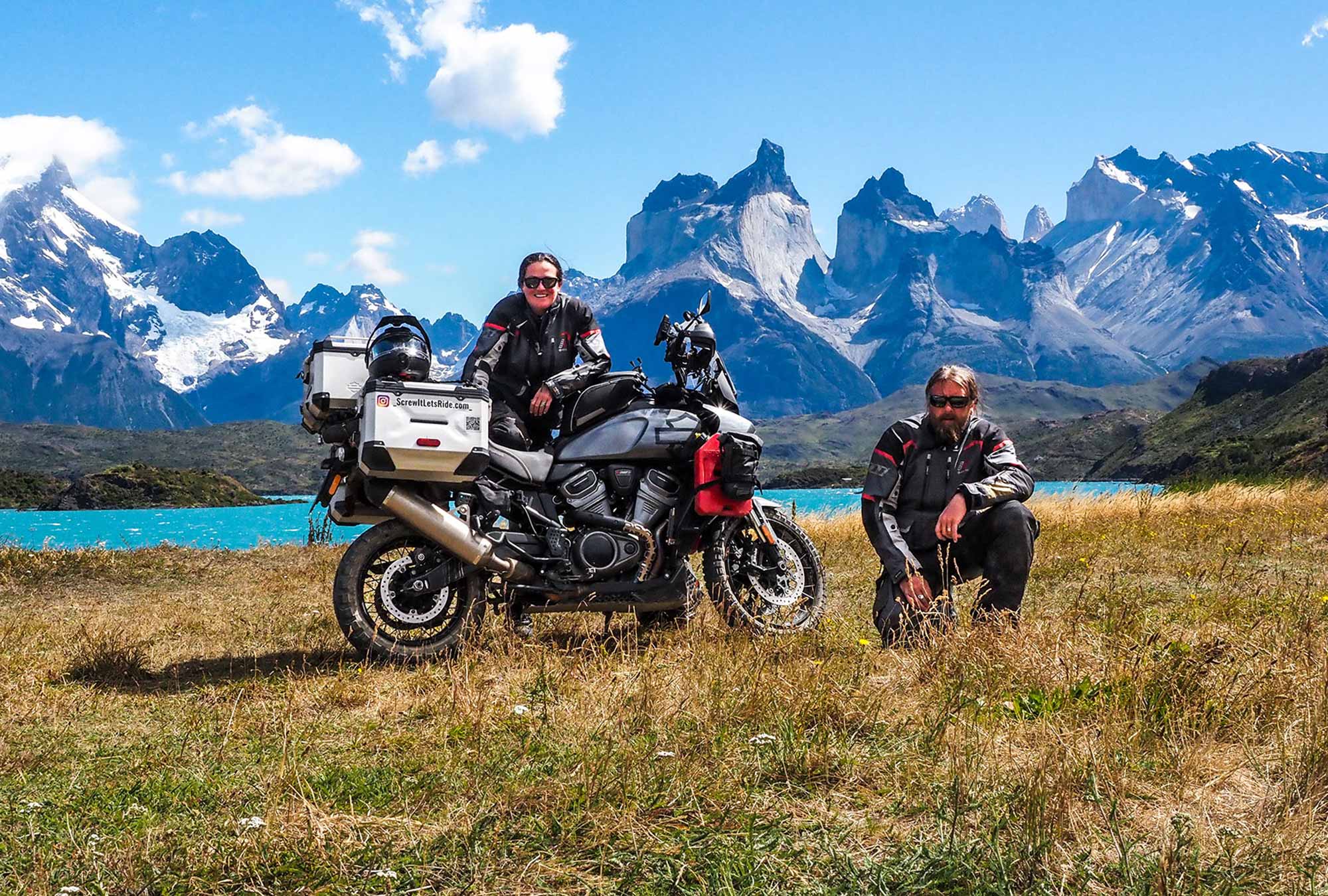 Ela and Greg with Pan America in front of a mountain range