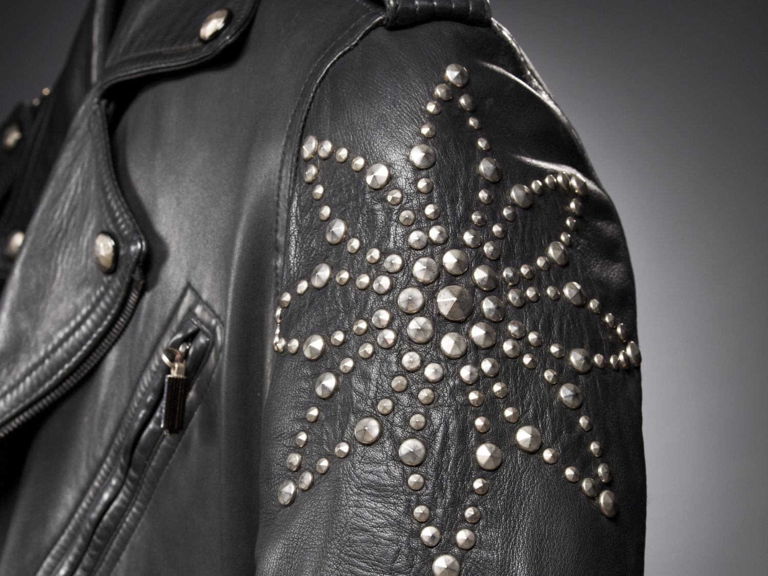Close-up of a Versace leather jacket's sleeve.
