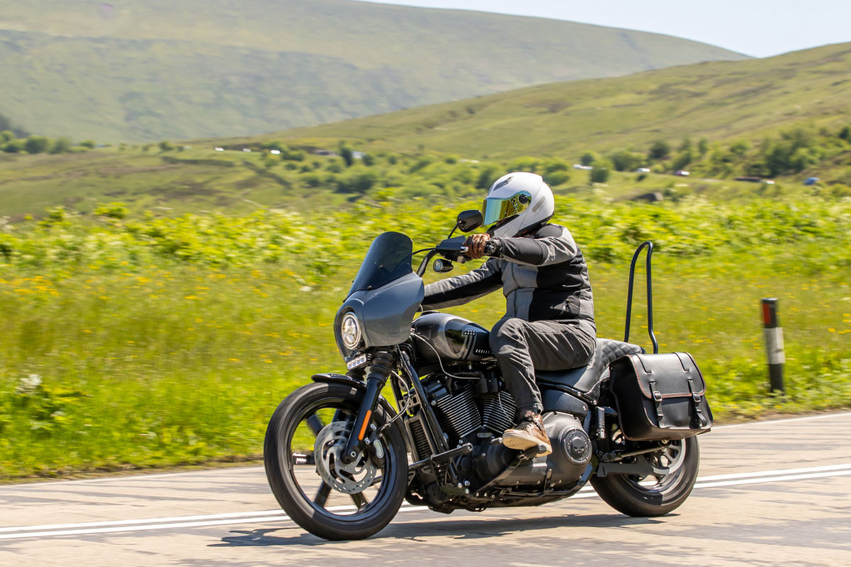 Biker riding along the road